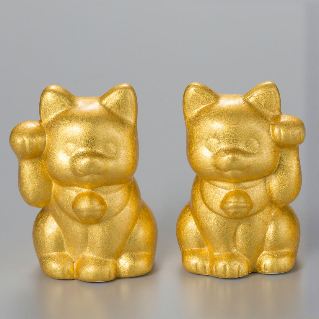 A decorative Maneki Neko lucky cat with a raised right paw, finished with Hakuichi foil craftsmanship. It works well as a gift item, souvenir, shop display, or small interior accent connected to Japanese good-luck culture.