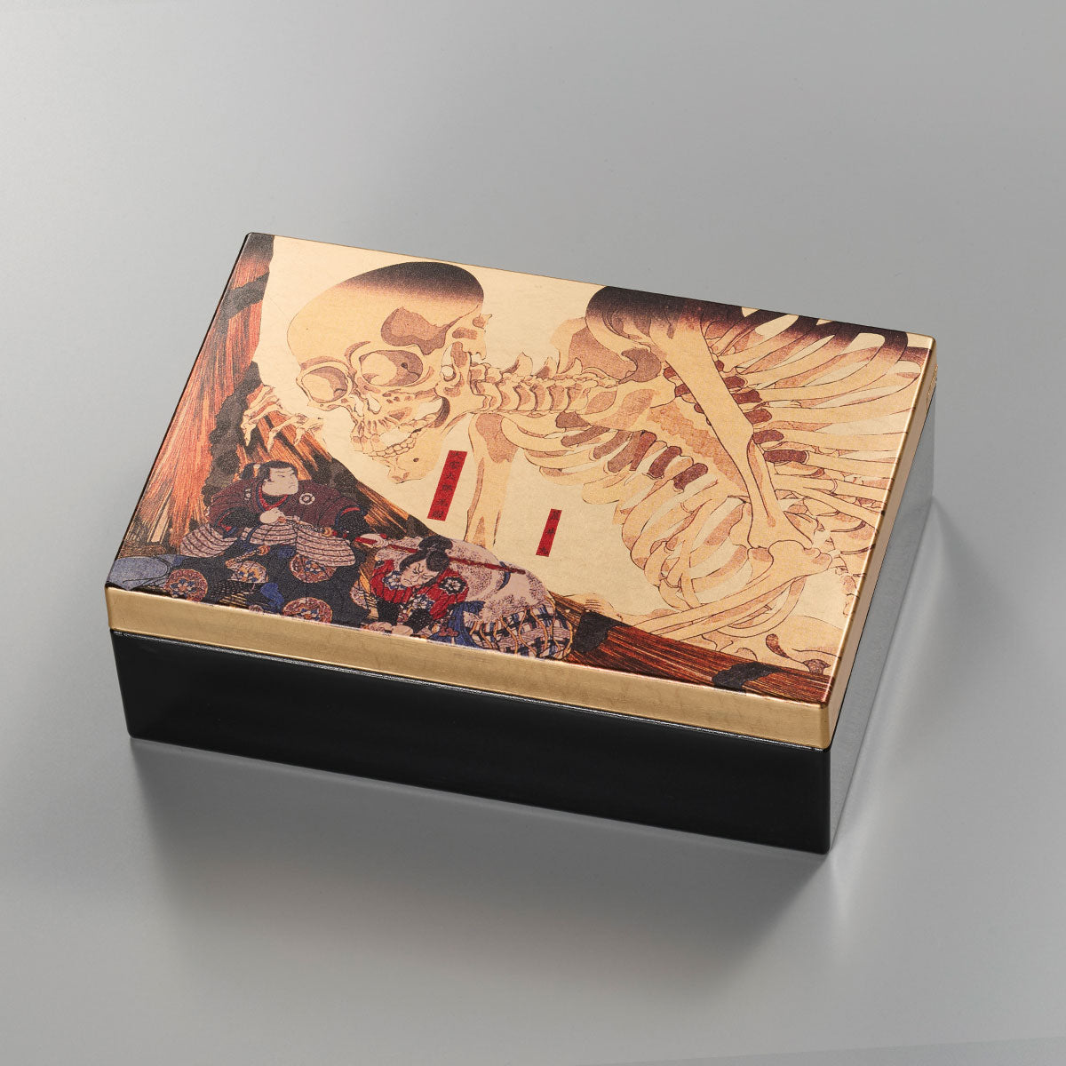 A decorative storage box with Japanese art-inspired design and foil accents. It is suitable for keeping small accessories, presenting gifts, or adding a compact Japanese craft item to gift and home interior displays.